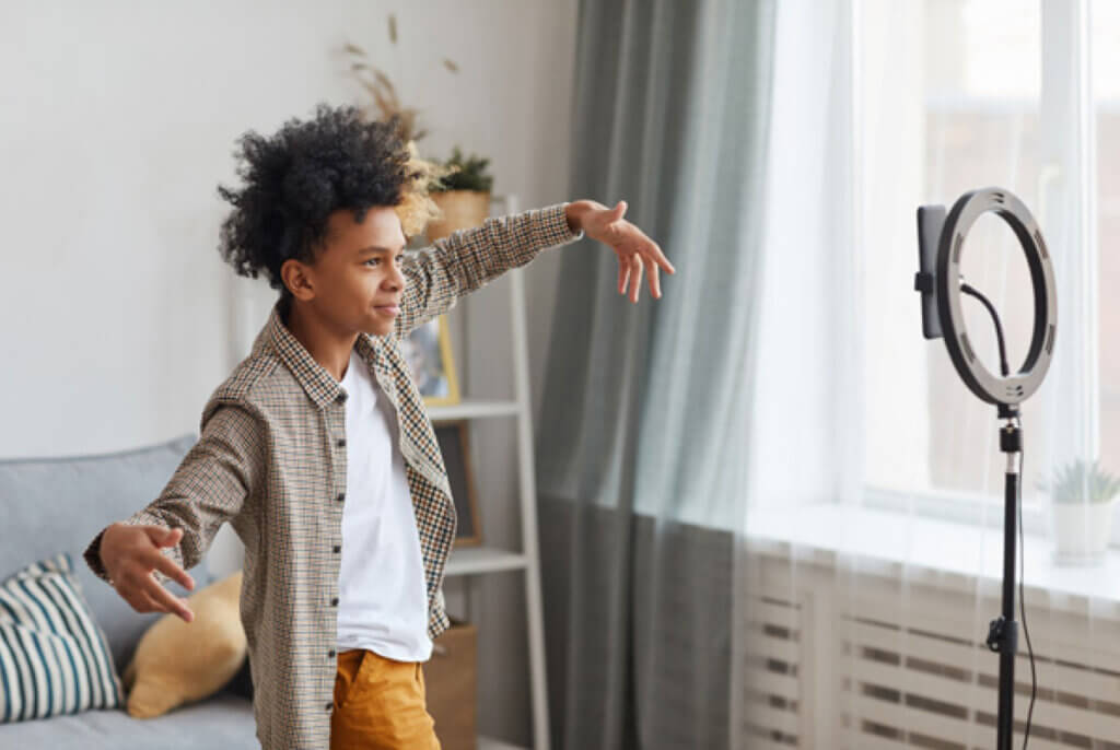 Boy dancing in front of phone camera