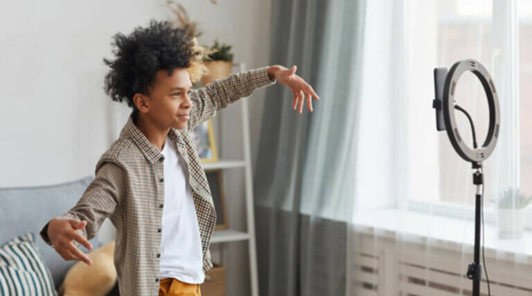  Boy posing in front of phone camera