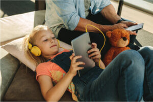 Girl on tablet with father