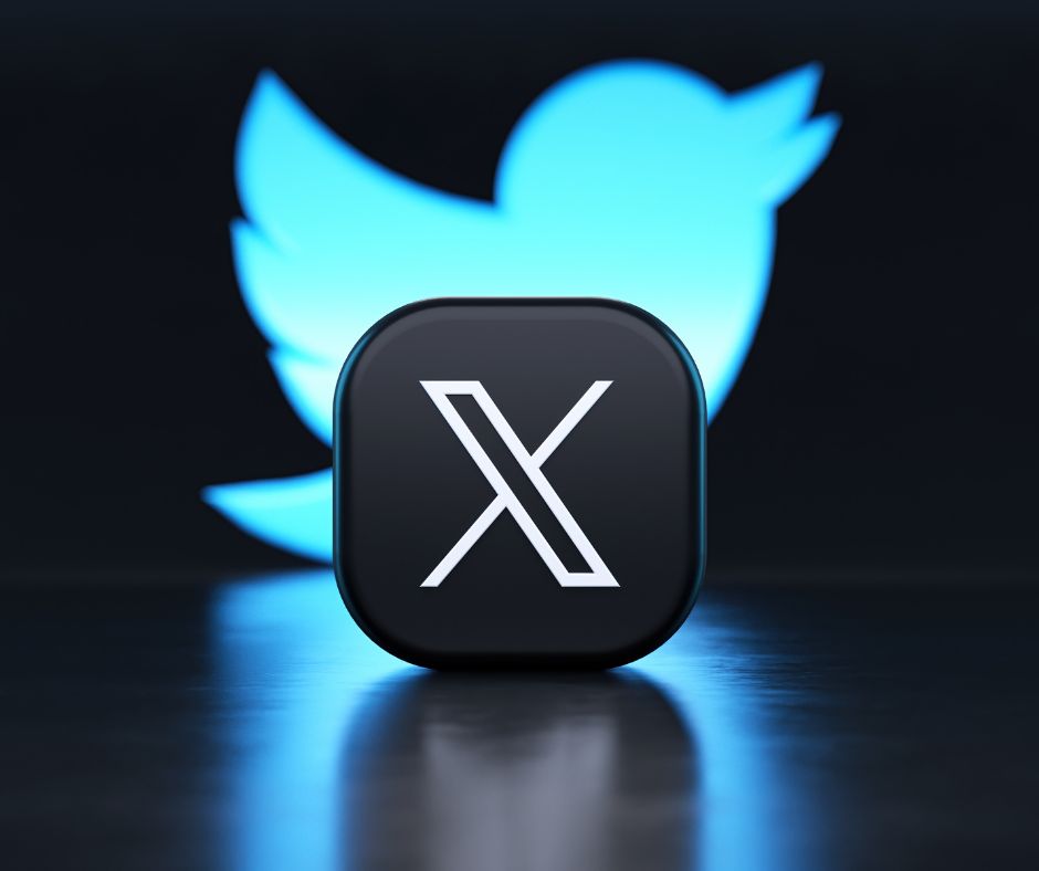 The logo for X in white with a black square in front of the twitter blue bird logo